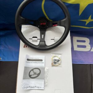 Avtosh black leather sport steering wheel shown with its box, instruction booklet and visible accessories.