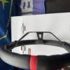 Upper side detail showing the red centre marker and leather stitching on the steering wheel rim.
