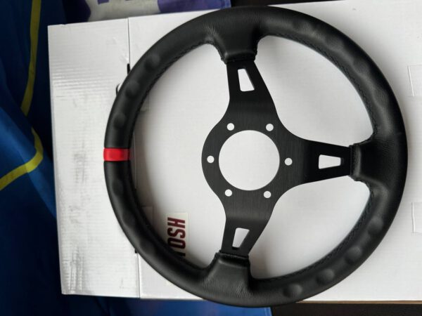 Rear view of the steering wheel showing the black spokes, leather rim and centre mounting holes.